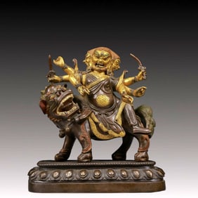 A Solemn Gilt Bronze Statue of Mammon Rides the Lion