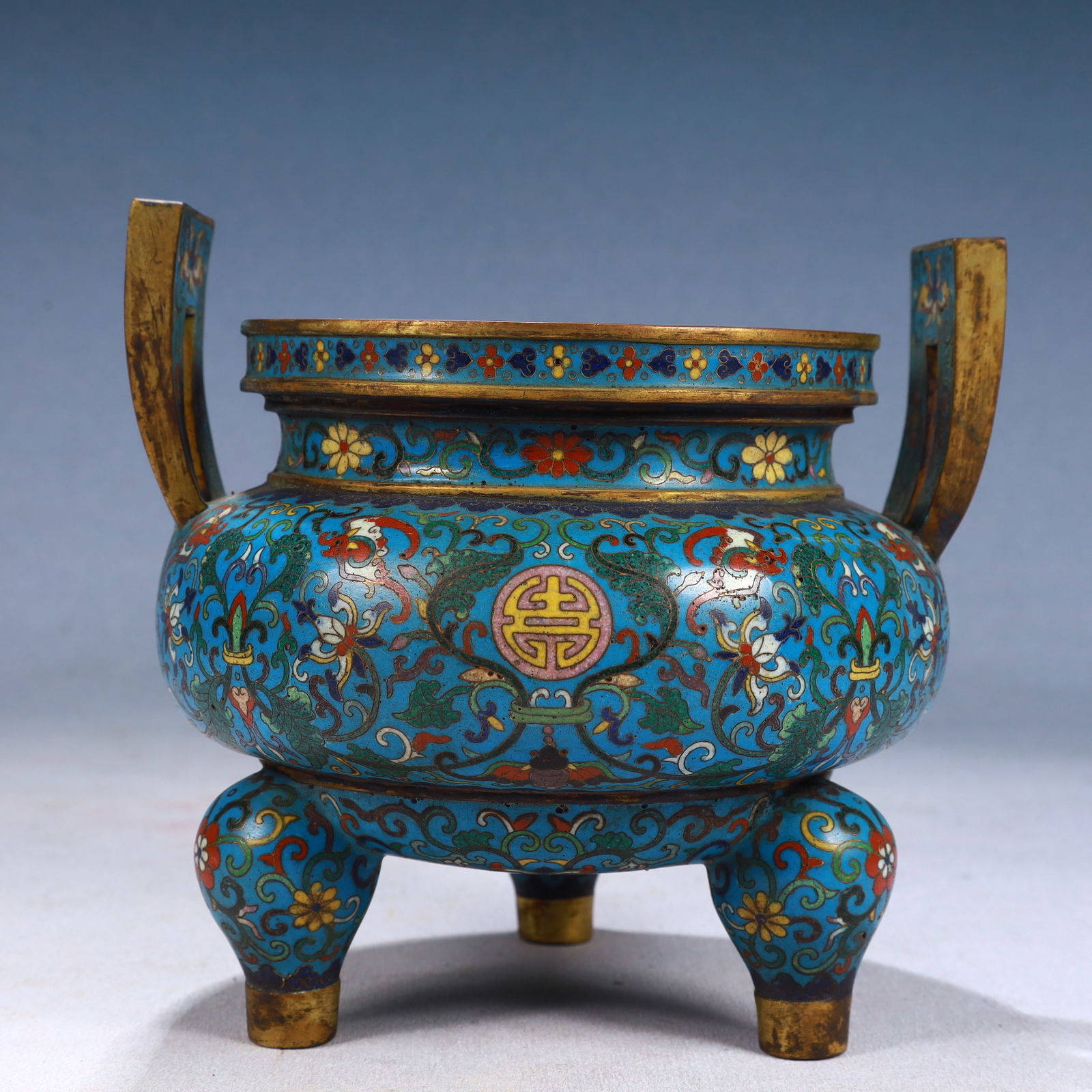 An Exquisite Cloisonne Lotus Pattern Lion-Ears and Tripod Jar: An Exquisite Cloisonne Lotus Pattern Lion-Ears and Tripod Jar,Qing Dynasty, China,Qianlong Four-character Mark,Size:6.3inx6.1in,Weight:1600g 景泰蓝缠枝莲纹