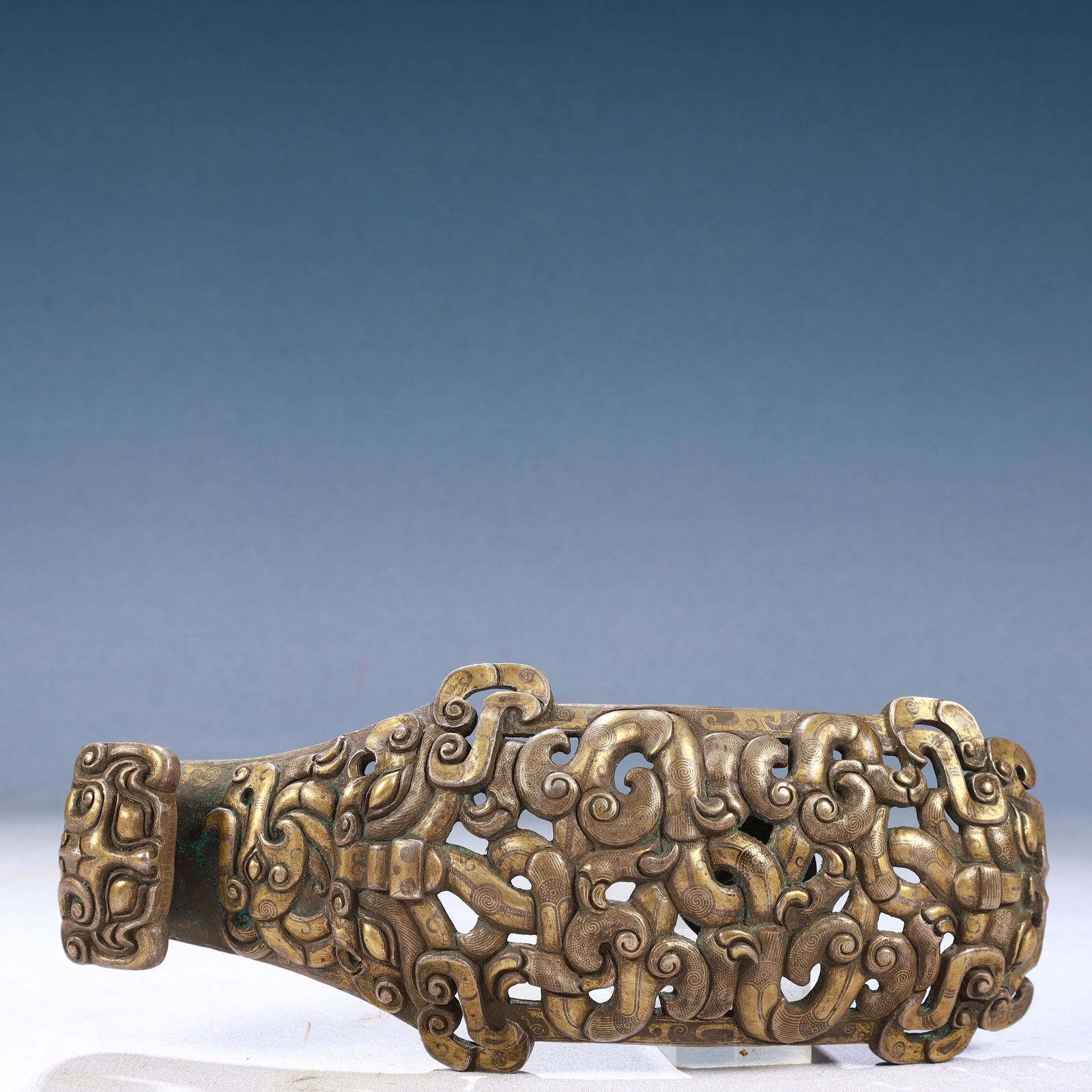 An Exquisite Bronze Inlaid Gold and Silver Auspicious Beast Pattern Hook: An Exquisite Bronze Inlaid Gold and Silver Auspicious Beast Pattern Hook,Qing Dynasty, China,Size:3.5inx8.7inx2in,Weight:600g 铜错金银瑞兽纹带钩,&