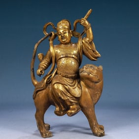 A Solemn Gilt Bronze Statue of Dharma Protector Rides the Tiger