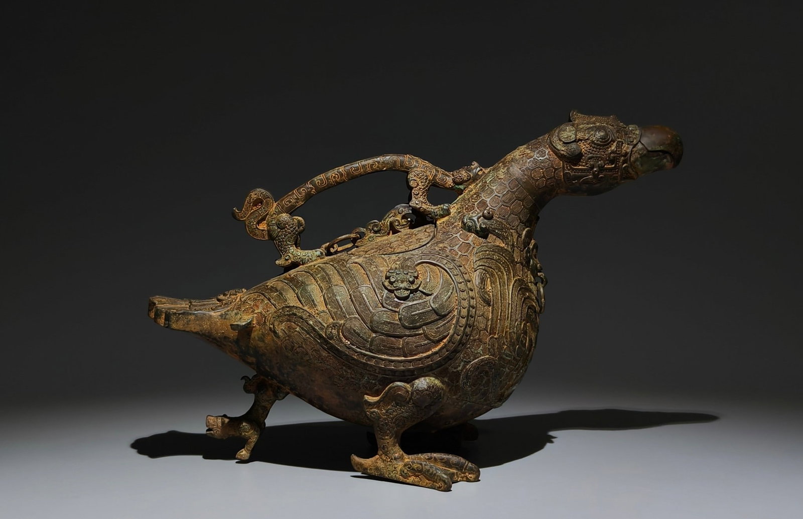 An Archaic Bronze Chi-Dragon Pattern Bird-Shaped Food Vessel,With Inscription: An Archaic Bronze Chi-Dragon Pattern Bird-Shaped Food Vessel,With Inscription,the Spring and Autumn in Period in China,Size:9.4inx14.2inx6.3in 青铜螭龙纹鸟形&
