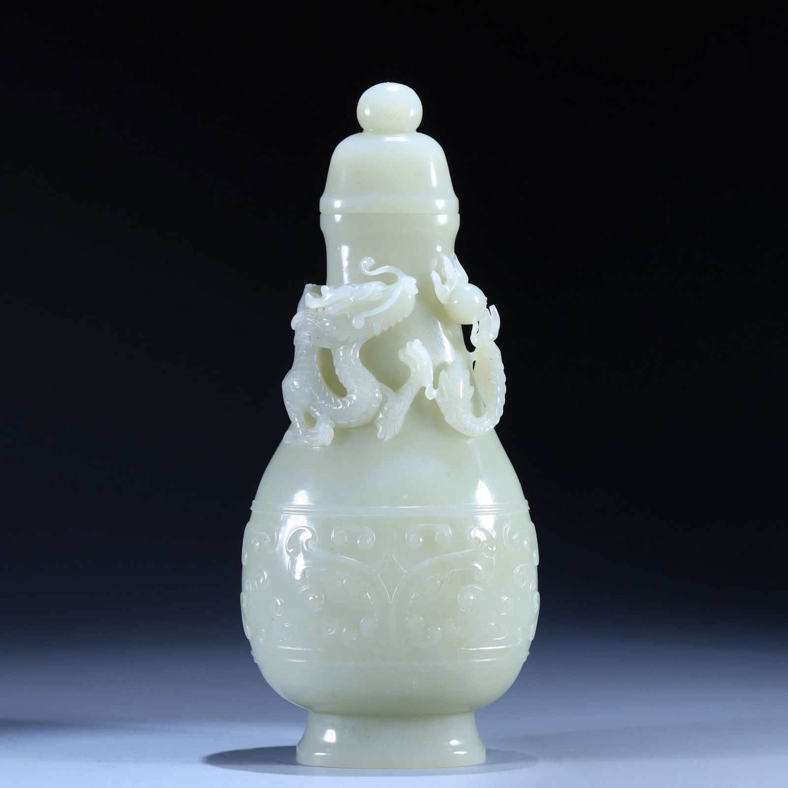 An Exquisite White Jade Beast-Face and Dragon Pattern Bottle (1 of 9)