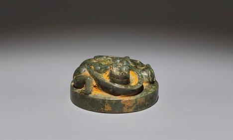An Archaic Bronze Auspicious Beast-Shaped Ornament