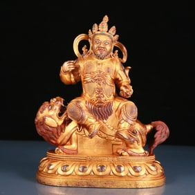 A solemn gilt bronze statue of the King of Treasures