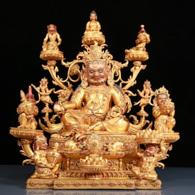 A solemn gilt bronze statue of the God of Wealth