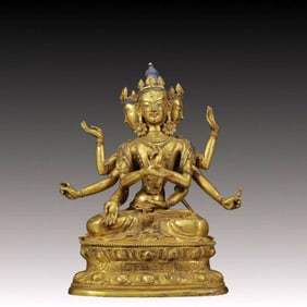 A Solemn Gilt Bronze Eight-Armed Statue of Gautama’s Mother