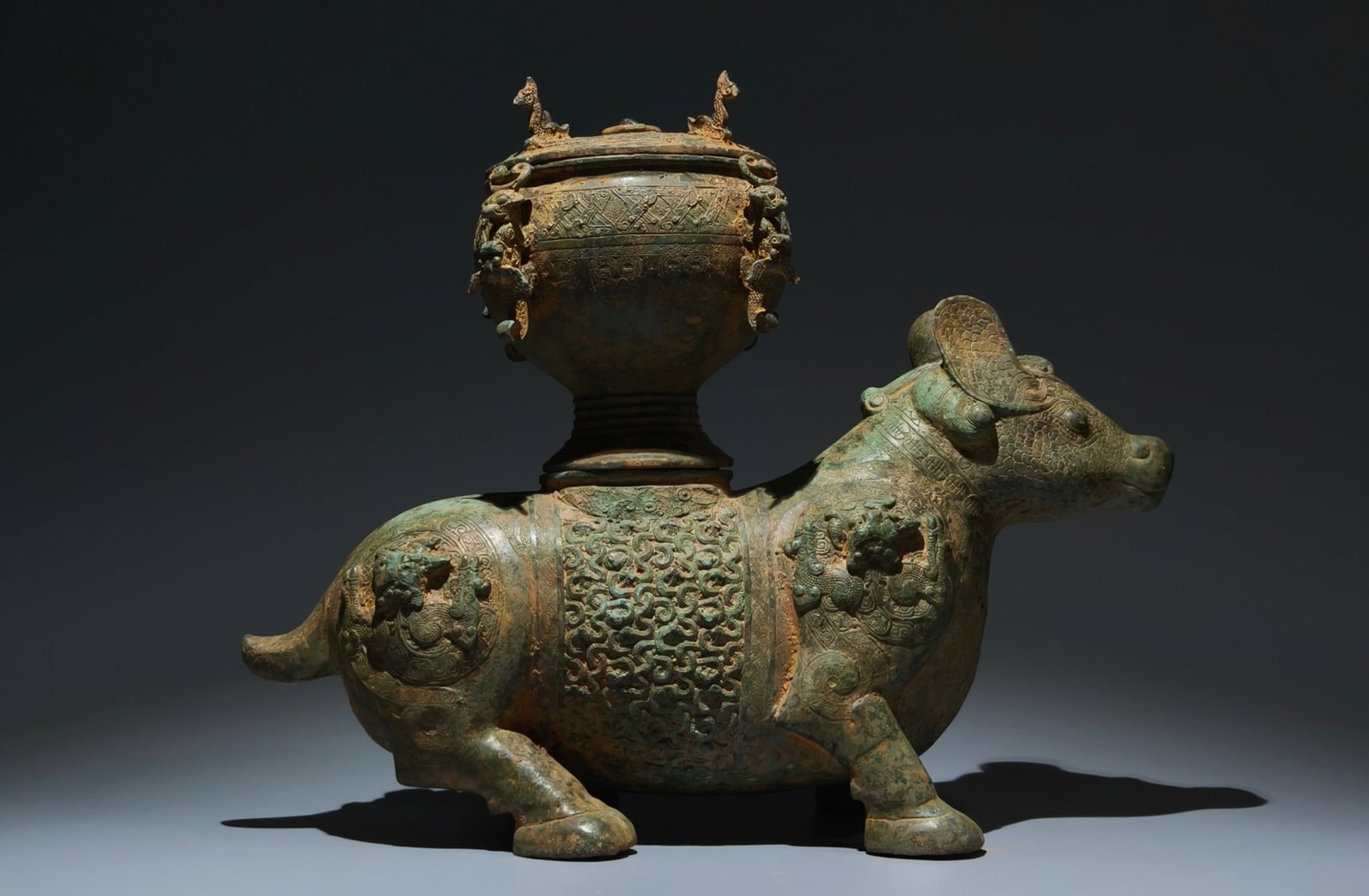 An Archaic Bronze Coiling Dragon Pattern Beast-Shaped Zun,With Inscription (1 of 9)