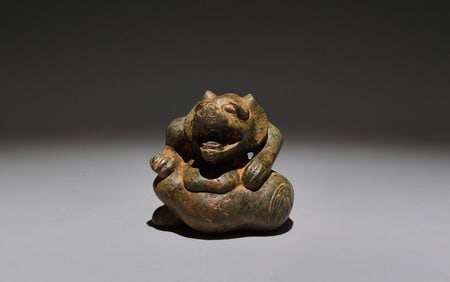An Archaic Bronze Bear Ornament