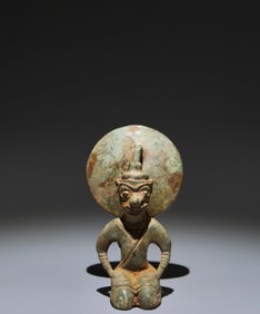 An Archaic Bronze Figure-Shaped Candlestick