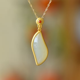 An Exquisite Sterling Silver-Gold Plated Inlaid White Jade Pendant