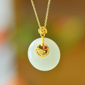 An Exquisite Sterling Silver-Gold Plated Inlaid White Jade Pendant