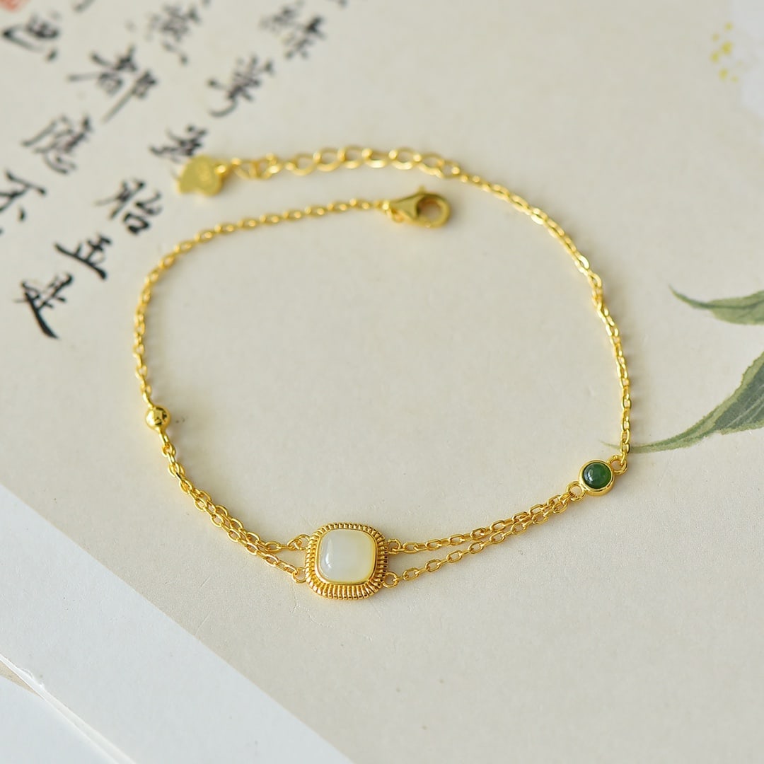 An Exquisite Sterling Silver-Gold Plated Inlaid White Jade Bracelet: An Exquisite Sterling Silver-Gold Plated Inlaid White Jade Bracelet,Size:6mmx6mm 纯银镀金镶白玉手链
