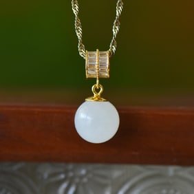 An Exquisite Sterling Silver-Gold Plated Inlaid White Jade Pendant