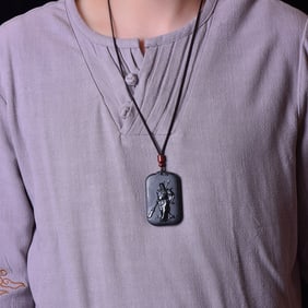 An Exquisite Sapphire Guangong Pattern Pendant