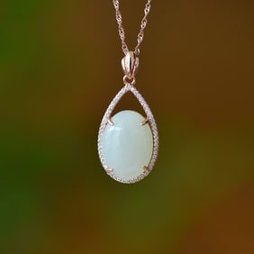 An Exquisite Sterling Silver-Gold Plated Inlaid White Jade Pendant