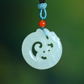An Exquisite White Jade Dragon Pendant