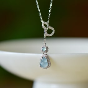An Exquisite Sterling Silver Inlaid Jadeite Pendant