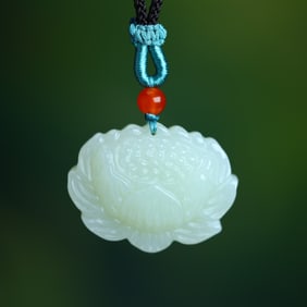 An Exquisite White Jade Lotus Pendant