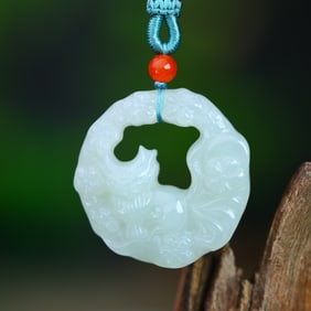 An Exquisite White Jade Nine-Tailed Fox Pendant