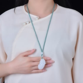 An Exquisite White Jade Auspicious Beast Pendant