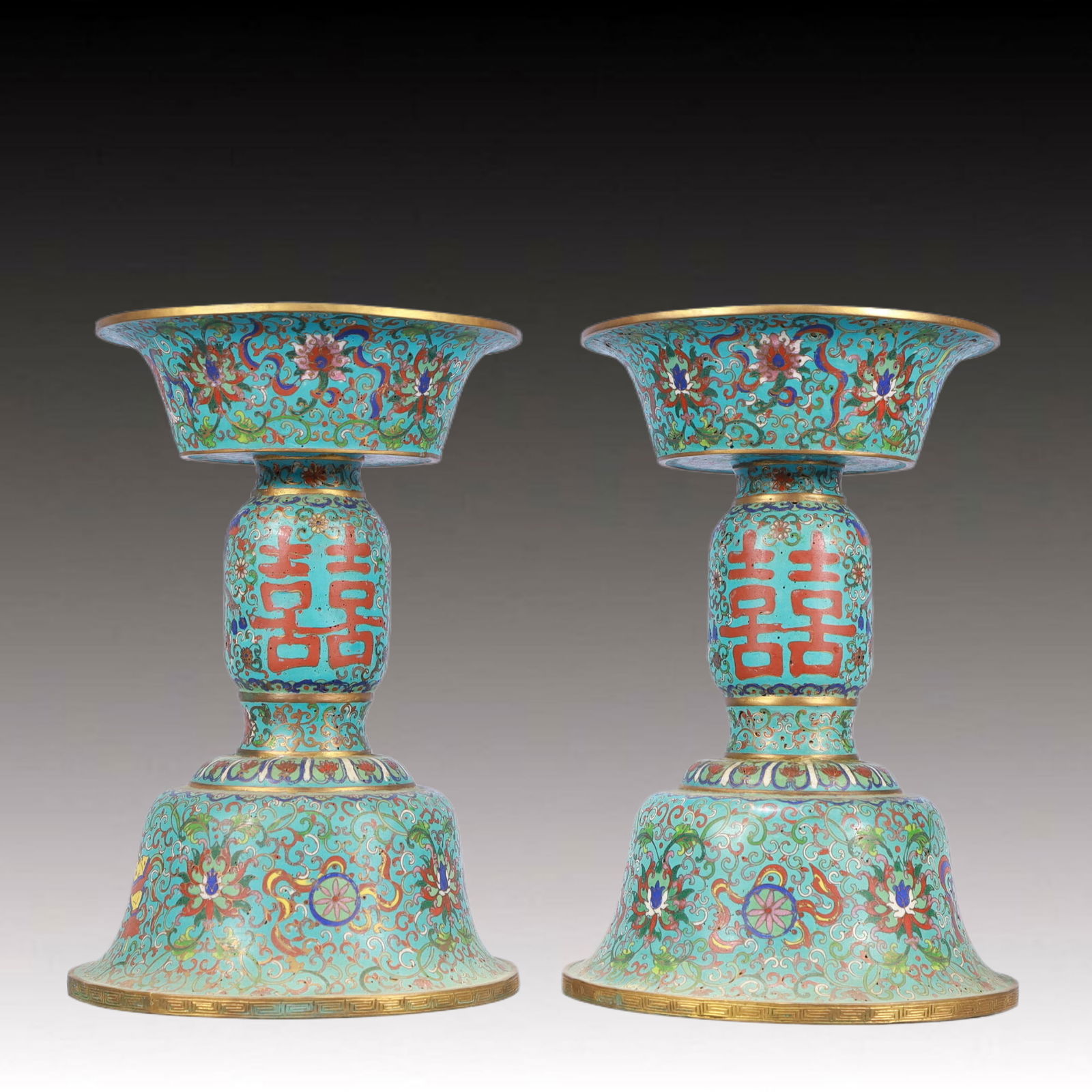 A Pair of Exquisite Cloisonne Lotus and Eight Treasures Pattern Candlesticks: A Pair of Exquisite Cloisonne Lotus and Eight Treasures Pattern Candlesticks,Qing Dynasty,China,Qianlong Four-character Mark,Size:6.7inx10.4in,Total Weight:3750g 一对景泰൉