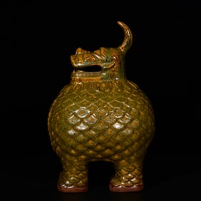 A Rare Teadust Glazed Auspicious Beast Ornament