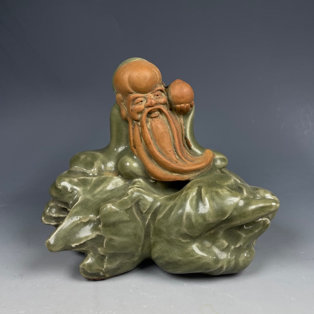 An Exquisite Longquan yao Figure Ornament: An Exquisite Longquan yao Figure Ornament,Yuan Dynasty,China,Size:4.7inx5.9in 龙泉窑人物摆件,中国宋代