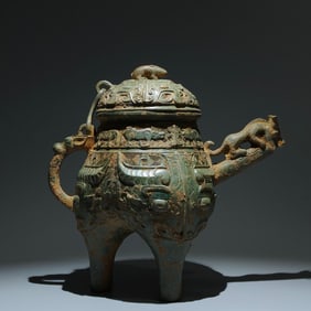 An Archaic Bronze Beast-Face Pattern Tripod Ritual vessel,with Inscription