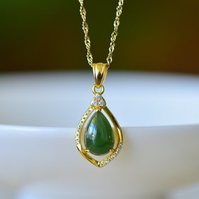 An Exquisite Sterling Silver-Gold Plated Inlaid White Jade Pendant