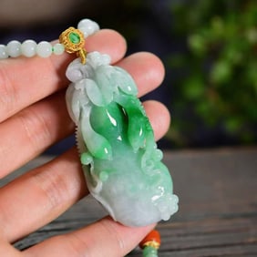 An Exquisite Jadeite Melon and Fruit Pendant
