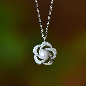 An Exquisite Sterling Silver Inlaid White Jade Pendant