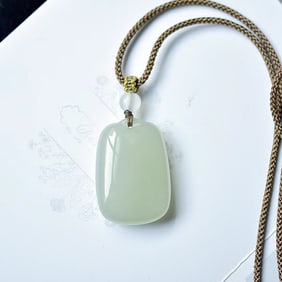 An Exquisite Greenish Jade Pendant
