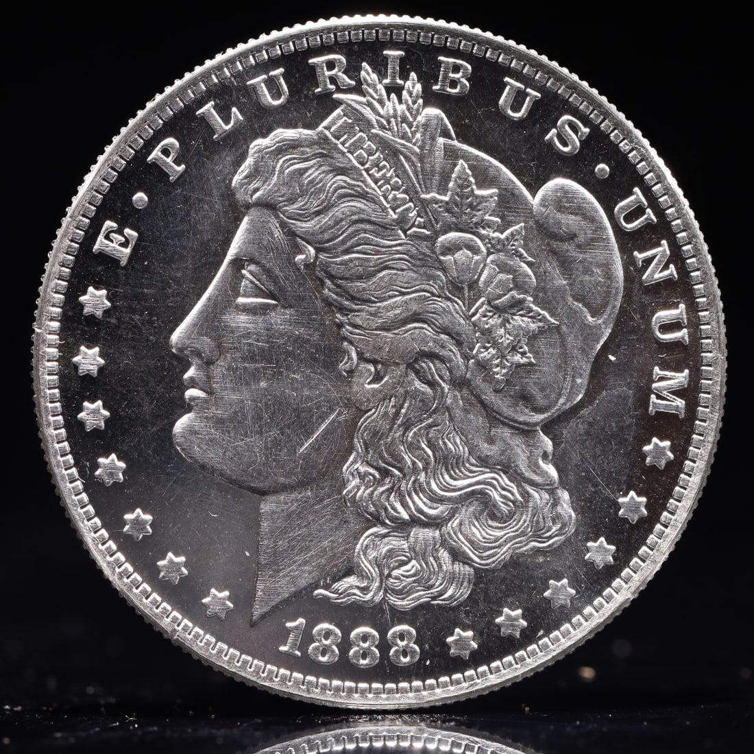 USA Morgan Dollar 1888 Coin: Obv: profile bust with date below and E PLURIBUS UNUM legend and stars around. Rev: eagle with In God we trust above within wreath with UNITED STATES OF AMERICA ONE DOLLAR legend. IN GOD WE TRUST /