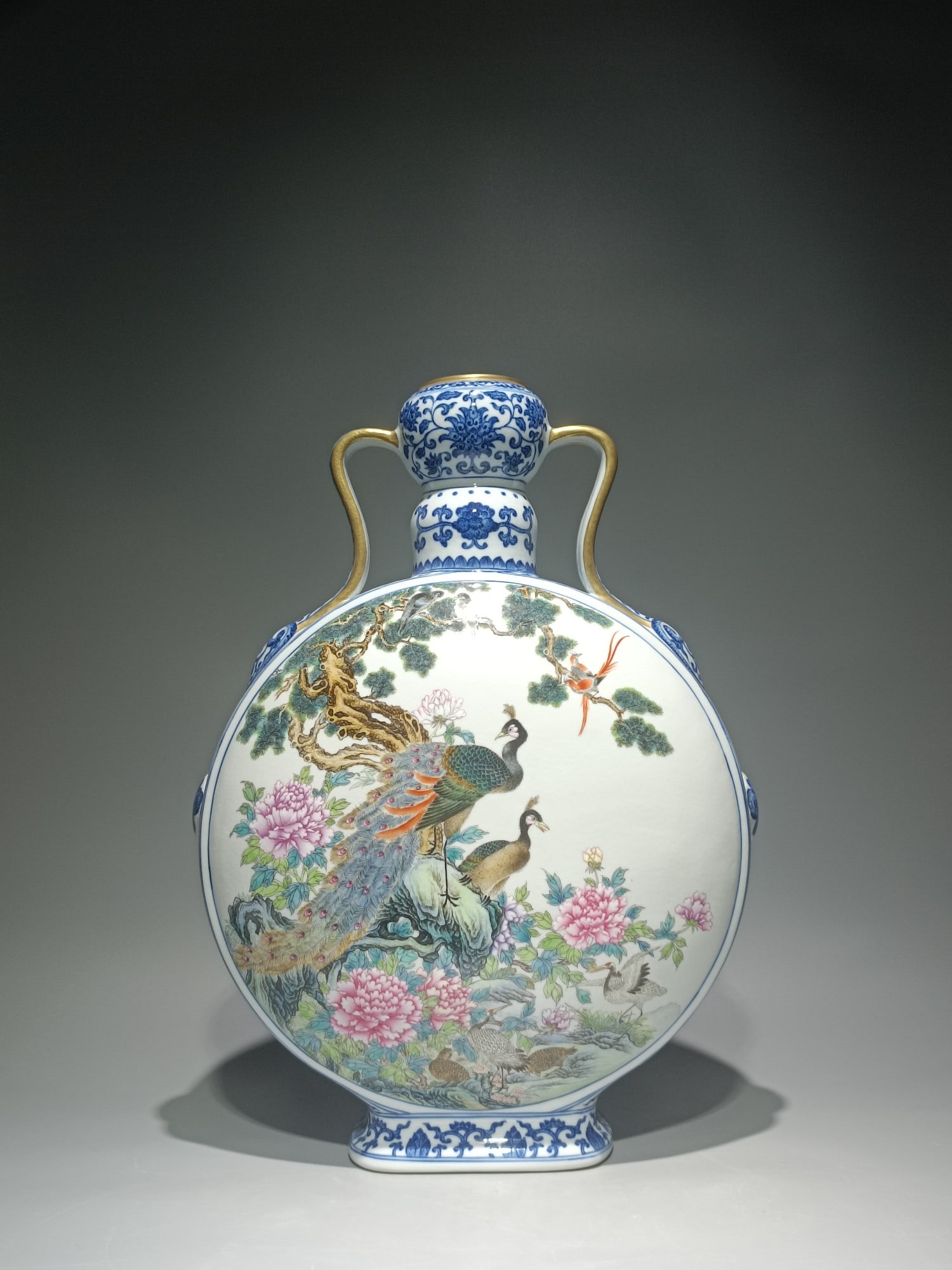 An Exquisite Blue and White Famille-Rose Flower and Peacock Pattern Double-Ears Vase: An Exquisite Blue and White Famille-Rose Flower and Peacock Pattern Double-Ears Vase,Qing Dynasty,China,Qianlong Six-character Mark,Size:16.5inx12.2in 