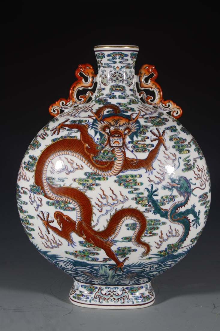 An Exquisite Doucai Auspicious Cloud and Dragon Pattern Double-Ears Vase: An Exquisite Doucai Auspicious Cloud and Dragon Pattern Double-Ears Vase,Qing Dynasty,China,Qianlong Six-character Mark,Size:19.7inx6.5in 