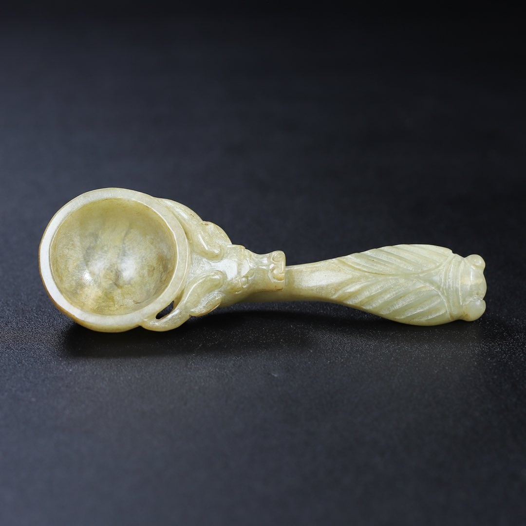 An Exquisite White Jade Buffalo Pattern Spoon (1 of 9)