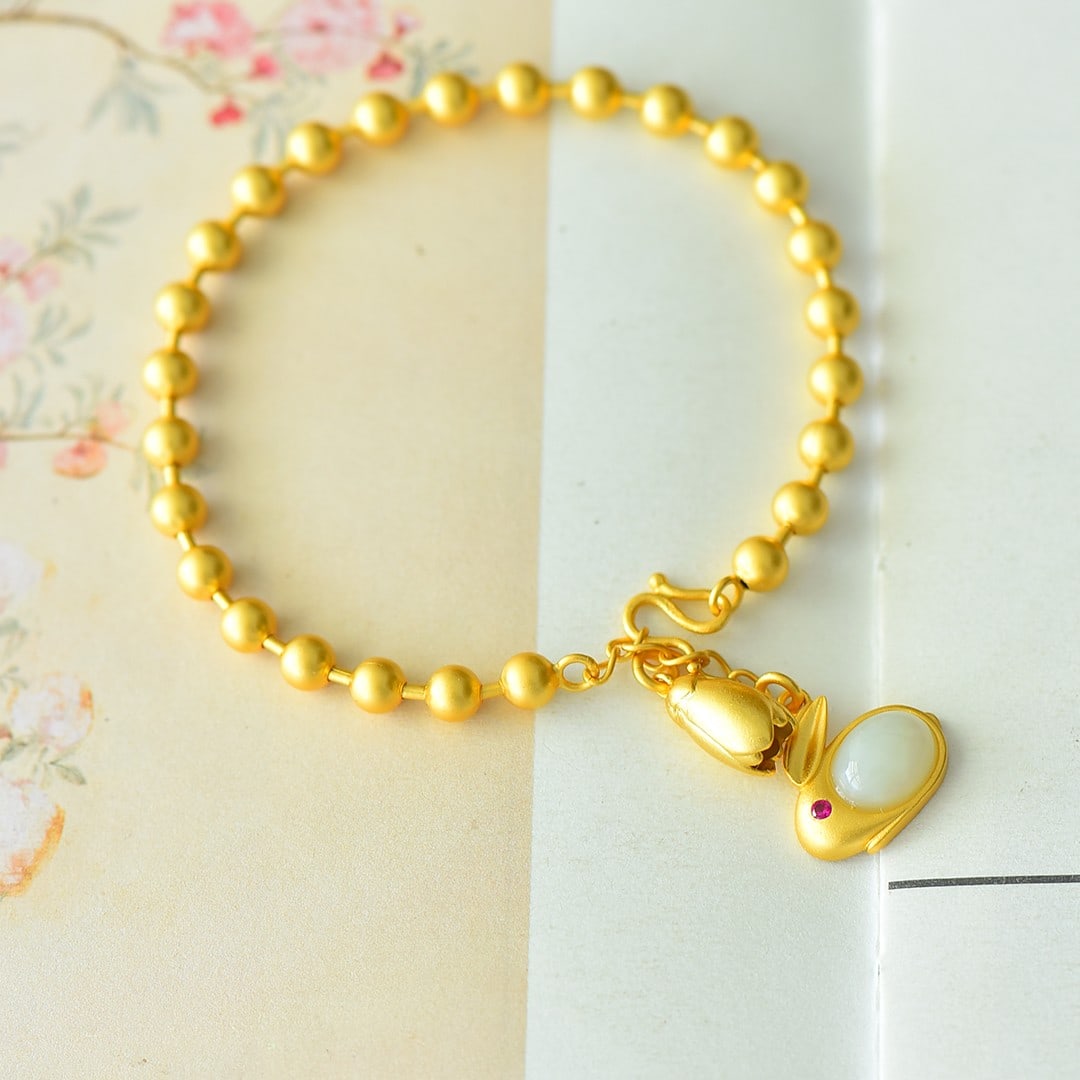 An Exquisite Sterling Silver-Gold Plated Inlaid White Jade Bracelet: An Exquisite Sterling Silver-Gold Plated Inlaid White Jade Bracelet,Size:0.3inx0.4in 纯银镀金镶白玉手链