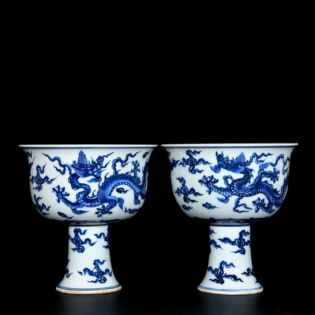 A Pair of Exquisite Blue and White Auspicious Cloud and Dragon Pattern Stem Bowls: A Pair of Exquisite Blue and White Auspicious Cloud and Dragon Pattern Stem Bowls,Ming Dynasty, China,Xuande Six-character Mark,Size:6.8inx6.4in 