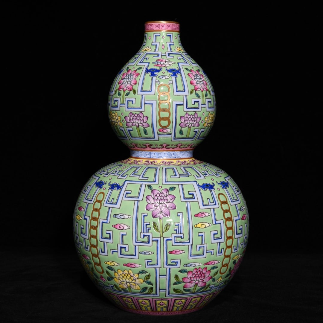 An Exquisite Green Ground Famille-Rose Painted Gold Flower Pattern Gourd-Shaped Vase: An Exquisite Green Ground Famille-Rose Painted Gold Flower Pattern Gourd-Shaped Vase,Qing Dynasty, China,Qianlong Six-character Mark,Size:11.2inx6.9in 