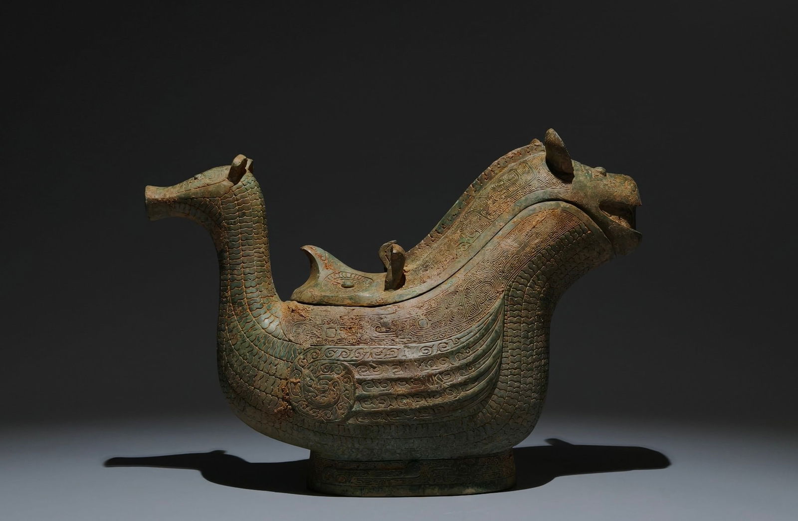 An Archaic Bronze Ruyi Pattern Auspicious Beast-Shaped Food Vessel (1 of 9)