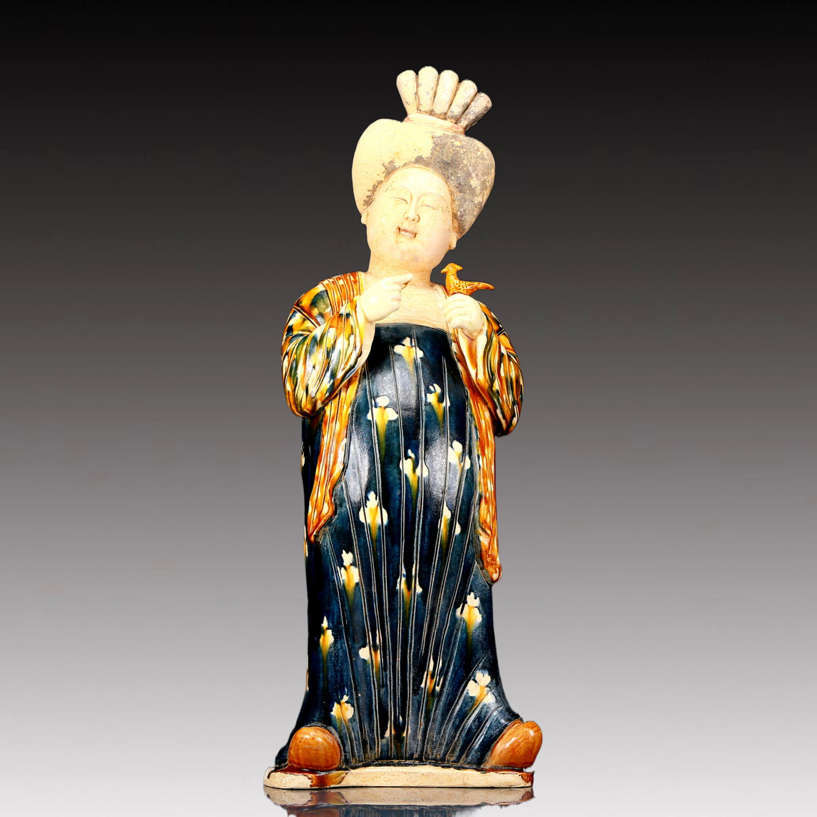 A Rare Tang Tri-Color Glazed Pottery Woman Ornament: A Rare Tang Tri-Color Glazed Pottery Woman Ornament,Tang Dynasty, China,Chinese Tang Tri-colored Pottery, or Tang Sancai, flourished during the Tang Dynasty (618–907 AD). It's renowned for its