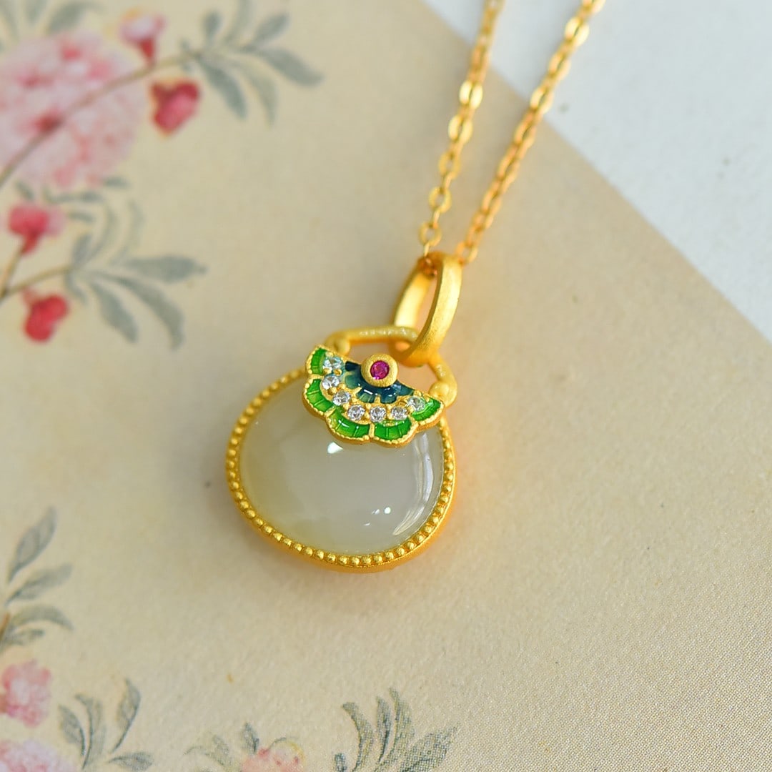An Exquisite Sterling Silver-Gold Plated Inlaid White Jade Enamel Pendant: An Exquisite Sterling Silver-Gold Plated Inlaid White Jade Enamel Pendant 纯银镀金镶白玉珐琅吊坠