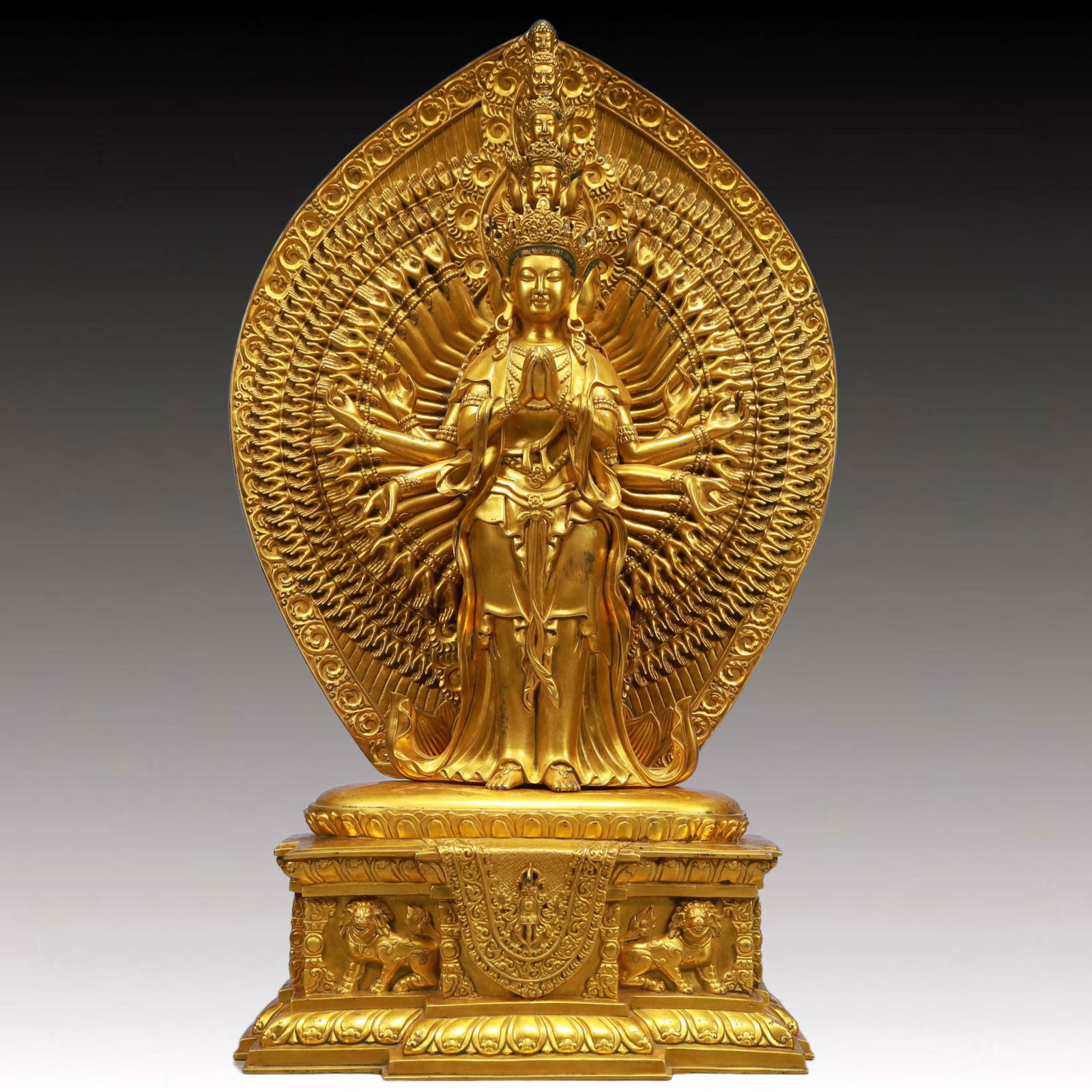 A Solemn Gilt Bronze Statue of Thousand-hand Guanyin: A Solemn Gilt Bronze Statue of Thousand-hand Guanyin,Qing Dynasty, China,Qianlong Mark,Size:9.4inx5.9inx18.5in,Weight:14850g 