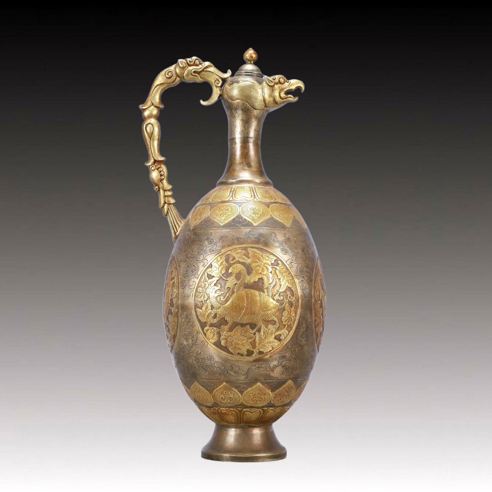 A Huge Gilt Silver Auspicious Beast Pattern Ewer: A Huge Gilt Silver Auspicious Beast Pattern Ewer,Tang Dynasty, China,Size:6.7inx5.5inx15.7in,Weight:2400g 银鎏金瑞兽纹执壶,中国唐É