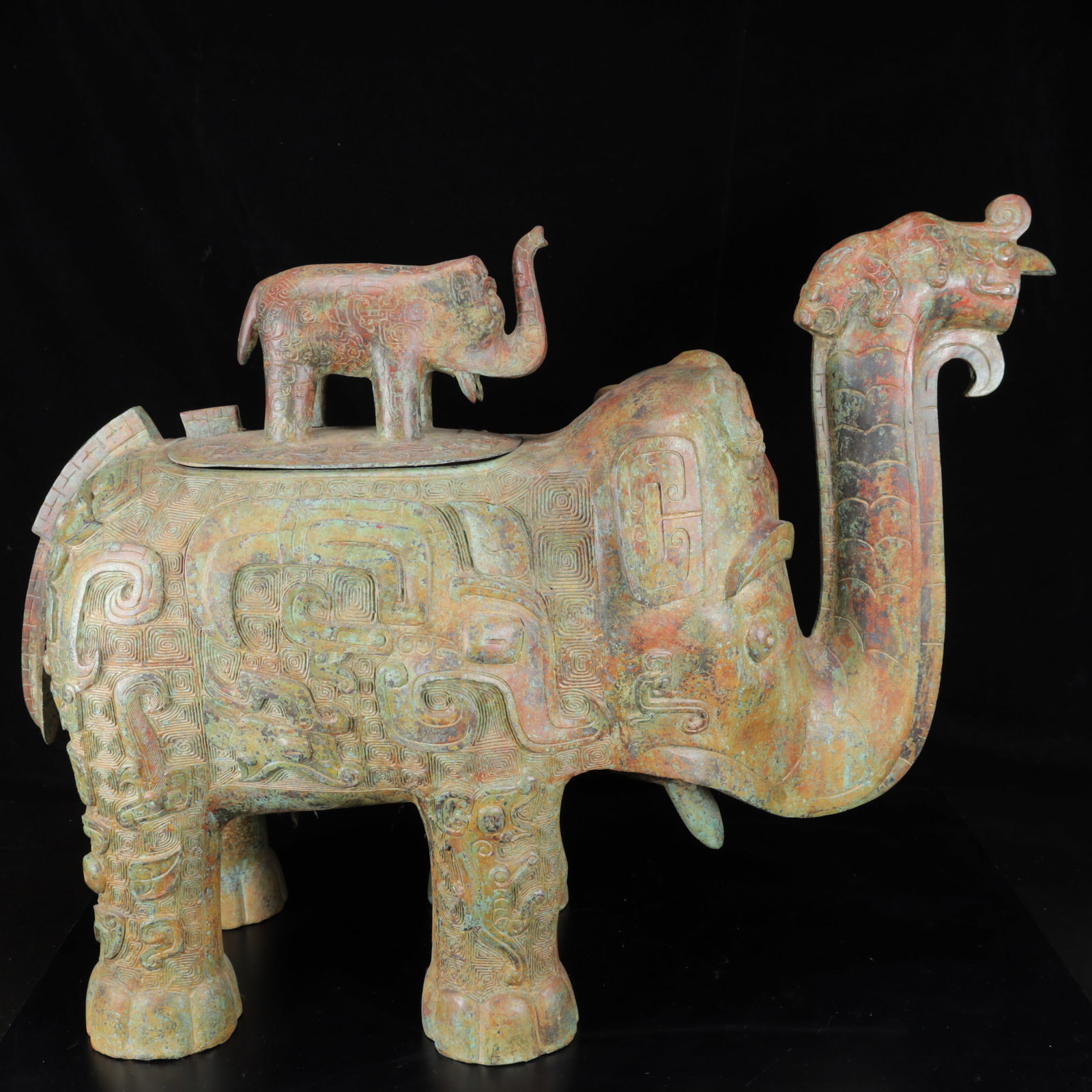 An Archaic Bronze Elephant Censer: An Archaic Bronze Elephant Censer,The Warring States period in China,Size:30.3inx11.8inx22.8in,Weight:25300g 青铜象香炉,中国战国时期