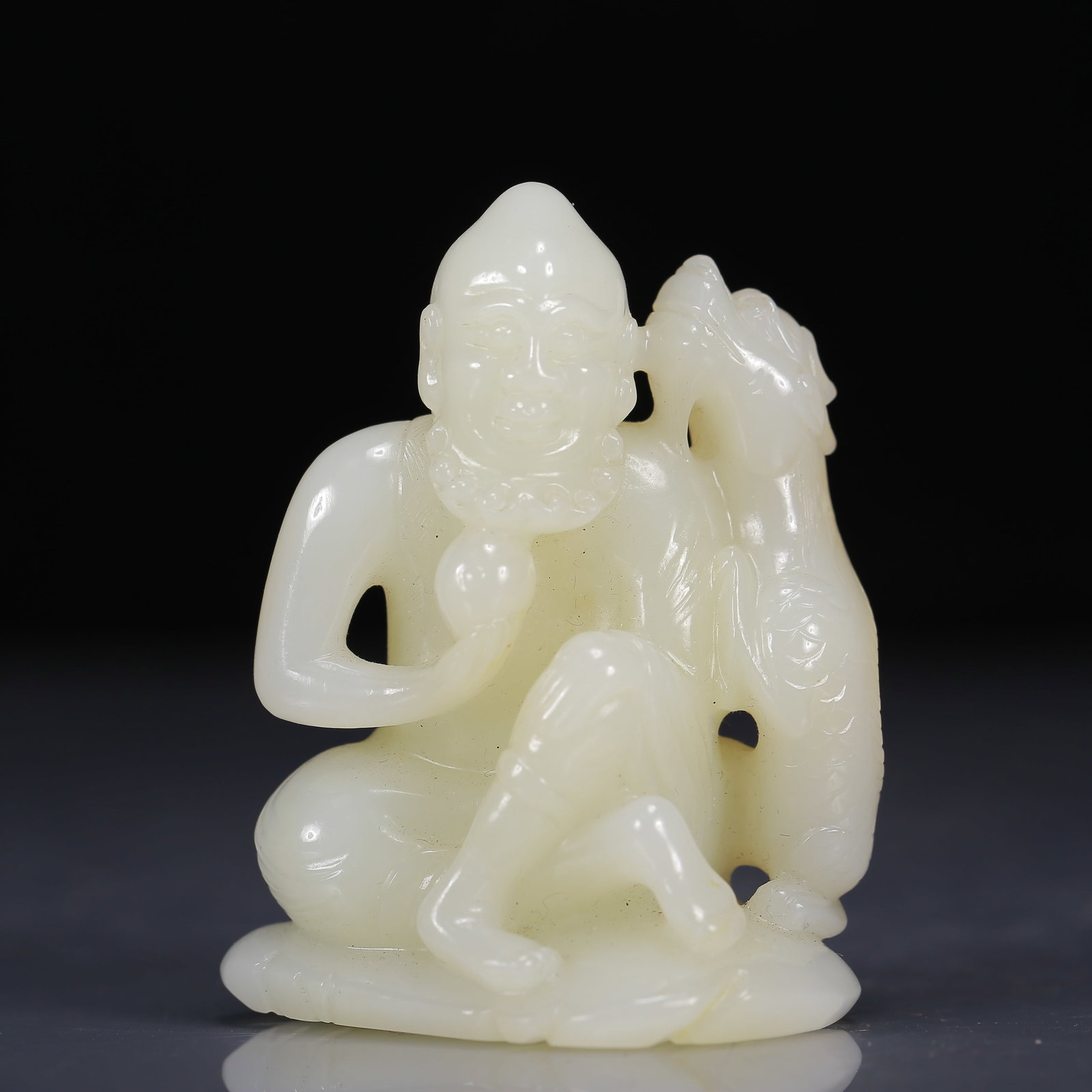 An Exquisite White Jade Arhat Ornament: An Exquisite White Jade Arhat Ornament,Qing Dynasty, China,Size:2.2inx1.4inx2.8in,Weight:135g 白玉伏虎罗汉摆件，清代