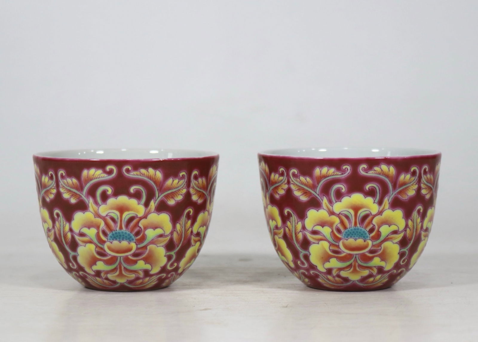 A Pair of Exquisite Famille-Rose Ruby Red-Glazed Lotus Pattern Cups: A Pair of Exquisite Famille-Rose Ruby Red Glazed Lotus Pattern Cups,Qing Dynasty,China,Yongzheng Four-character Mark,Size:3.1inx2.2ins 一对粉彩胭脂红缠&