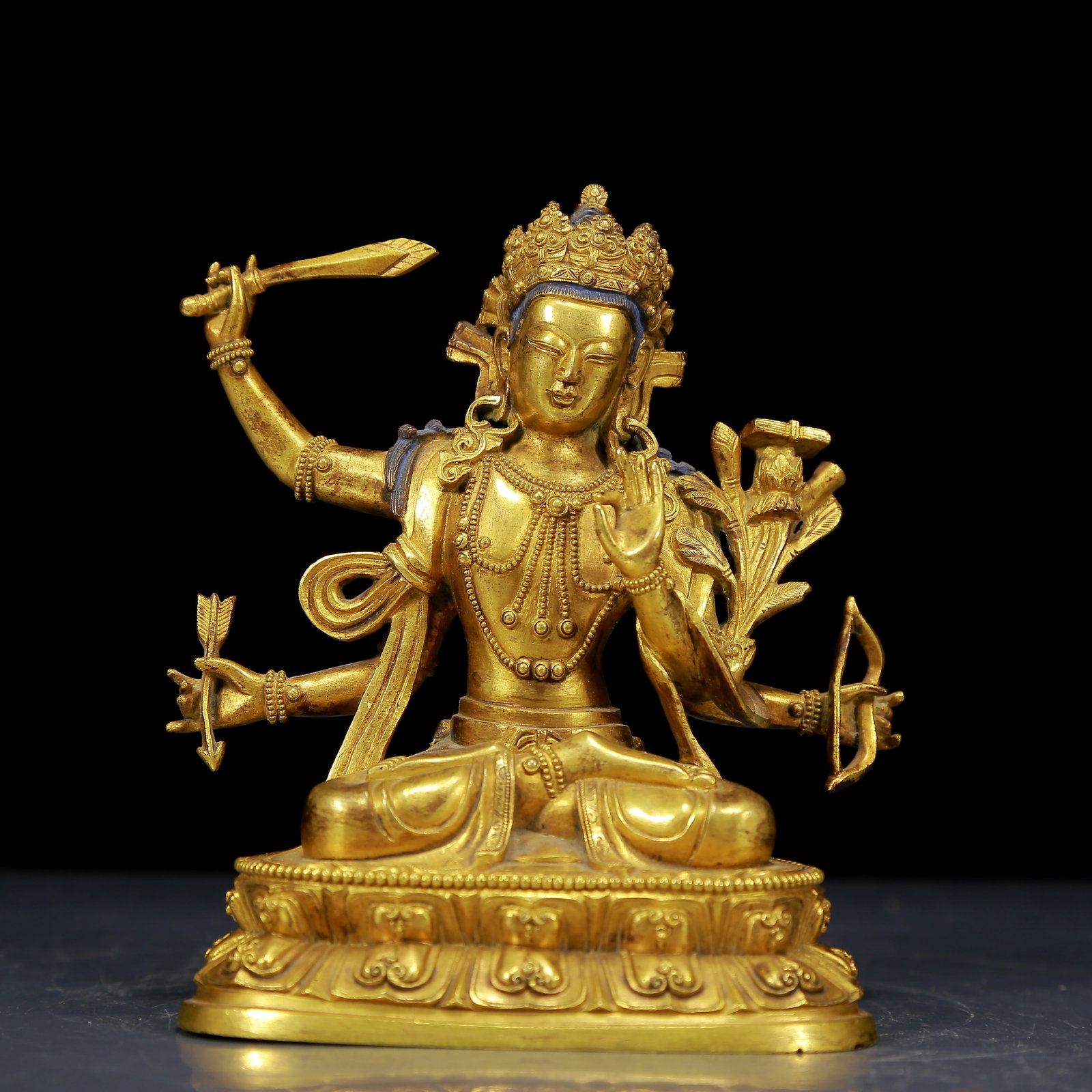 A Solemn Gilt Bronze Statue of Four-Armed Manjusri: A Solemn Gilt Bronze Statue of Four-Armed Manjusri,Ming Dynasty, China,Size:4.3inx3.1inx5.9in,Weight:1185g 铜鎏金四臂文殊菩萨像，ą