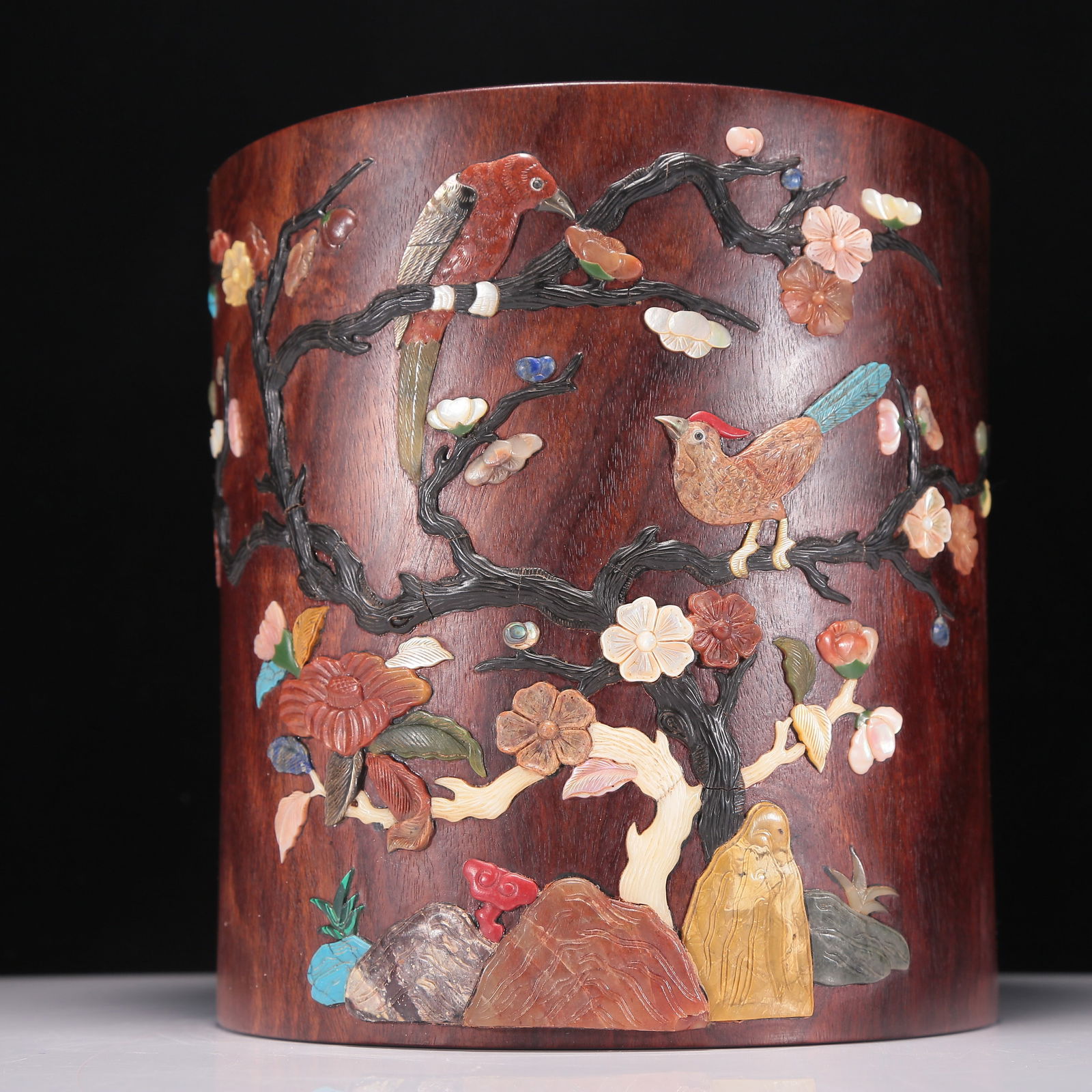 An Exquisite Huanghuali Gem-Inlaid 'Bird& Flower' Brush Pot With Poem Inscriptions: An Exquisite Huanghuali Gem-Inlaid 'Bird& Flower' Brush Pot With Poem Inscriptions. Of a cylindrical shape, the exterior enameled and inlaid in polychrome with birds with fine, detailed feather incisi