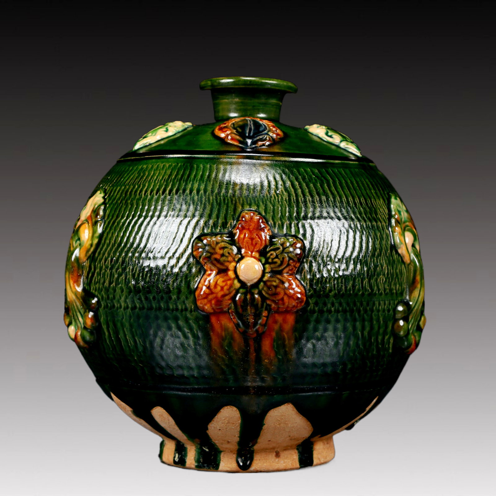 A Rare Tang Tri-Color Glazed Pottery Flower Pattern Jar: A Rare Tang Tri-Color Glazed Pottery Flower Pattern Jar,Tang Dynasty, China,Chinese Tang Tri-colored Pottery, or Tang Sancai, flourished during the Tang Dynasty (618–907 AD). It's renowned for i